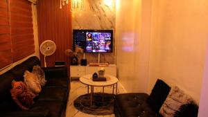 a living room with a couch and a table at Phoenix Bliss - Amber in General Trias