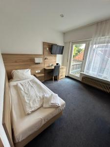 Postel nebo postele na pokoji v ubytování Hotel Allee 25