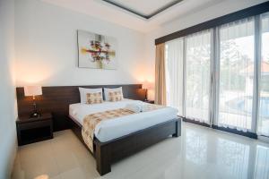 Katil atau katil-katil dalam bilik di D' Kubu Pratama Homestay