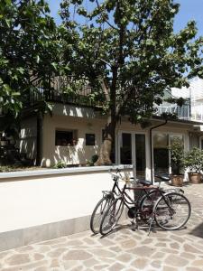 two bikes parked in front of a building at SanMarco54 in Cesena