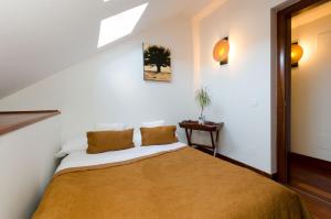 Postel nebo postele na pokoji v ubytování El Aura