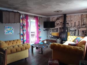 a living room with a couch and a table at Sailaway in Carbis Bay