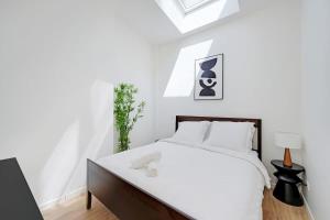 Ένα ή περισσότερα κρεβάτια σε δωμάτιο στο Paris Expo - Charming House at the Gates of Paris
