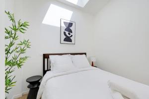 Ένα ή περισσότερα κρεβάτια σε δωμάτιο στο Paris Expo - Charming House at the Gates of Paris +5 φωτογραφίες
