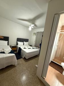 Postel nebo postele na pokoji v ubytování Suítes Praia Grande - Arraial do Cabo