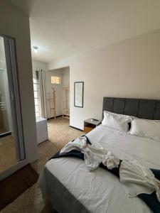 Postel nebo postele na pokoji v ubytování Suítes Praia Grande - Arraial do Cabo + 12 fotografií