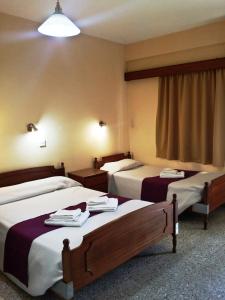 Postel nebo postele na pokoji v ubytování Minaides Hotel