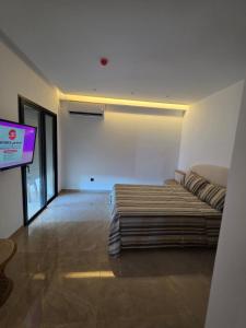 Ένα ή περισσότερα κρεβάτια σε δωμάτιο στο luxury apartments