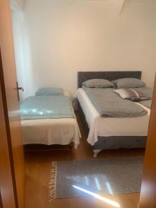 Katil atau katil-katil dalam bilik di Apartman Humska