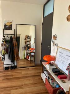 a room with a mirror and a wooden floor at depto vista laguna in San Fernando