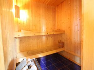 a wooden sauna with a shelf on the wall at Chalet in Rhone Valley near Ski Lift in Les Collons