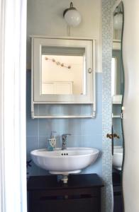 a bathroom with a sink and a mirror at Indipendenza 1 in Florence +15 photos