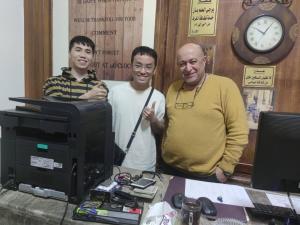 two men standing in front of a computer monitor at Bella Centro Citta in Cairo