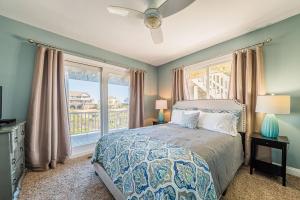 a bedroom with a bed and a large window at Arcadia in Duck +94 photos