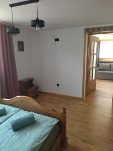 Ένα ή περισσότερα κρεβάτια σε δωμάτιο στο Apartament Gaya