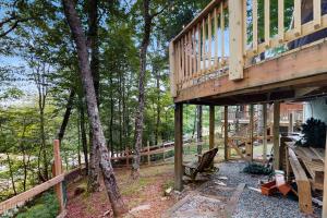 a wooden house in the middle of the woods at The Beech Hut in Beech Mountain