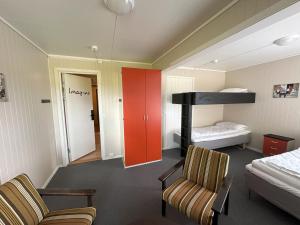 a room with a bed and a bunk bed at Karivollen Overnatting in Melhus