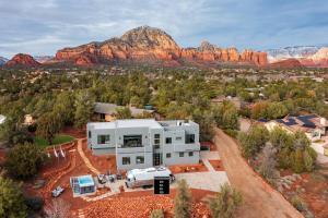 an aerial view of a house with mountains in the background at Sedona Epic Dream 5BR Pool & Spa Rooftop in Sedona