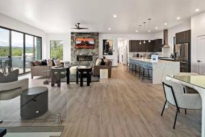 a kitchen and a living room with a couch and a table at Sedona Epic Dream 5BR Pool & Spa Rooftop in Sedona