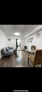 a living room with a couch and a table at Cosy Modern 1-Bed Apartment in Birmingham