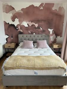 a bedroom with a bed with a map on the wall at Basin Road 2 Bed House in Chichester +3 photos