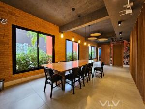a dining room with a large wooden table and chairs at Porto Privilege by VLV Stays in Salvador +42 photos