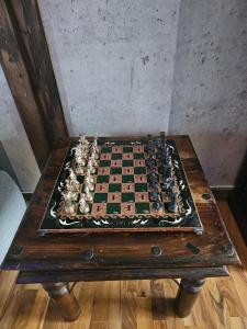 a chess board on top of a wooden table at Fredvang - 5 bedrooms Feriehus - Lofoten in Fredvang +33 photos