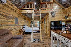 a bedroom with a bunk bed in a cabin at Little Wolf Cabins and ATV Rentals in Mena
