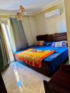 Un pat sau paturi într-o cameră la Golf Porto Marina Alamein North Coast VIP2Bedroom