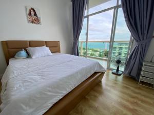 a bedroom with a bed and a large window at Muine, Vietnam, Apartment, 2Br in Phan Thiet
