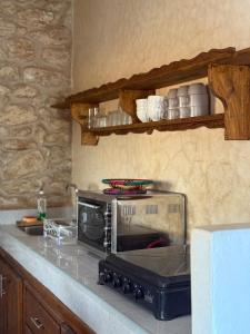 a toaster oven sitting on a counter in a kitchen at Holy house in Essaouira