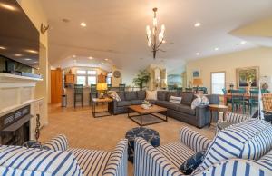 a living room with couches and a fireplace at Beach Cabana in Southern Shores