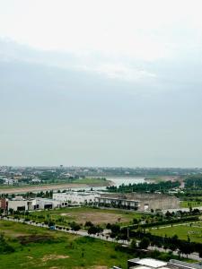 an aerial view of a city with a river and buildings at Cozy 1BR Designer Apartment, Gulberg Greens in Islamabad