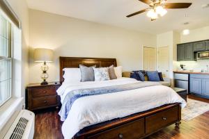 a bedroom with a large bed and a kitchen at Renovated Resort Condo, 2 Mi to Silver Dollar City in Reeds Spring +19 photos