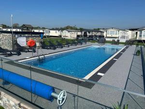 a swimming pool on top of a building at Ty hedd static caravan in Caernarfon +5 photos