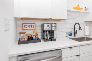 a kitchen counter with a coffee maker on it at Newly Renovated l Fire Pit Hot Tub Arcade in Indianapolis