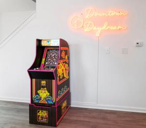 a video game machine sitting in a room at Newly Renovated l Fire Pit Hot Tub Arcade in Indianapolis