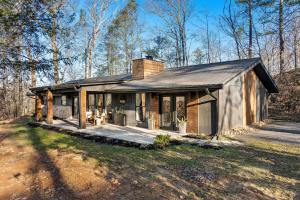 a small house in the woods at Relaxation & Recreation by American Patriot Getaways in Glade