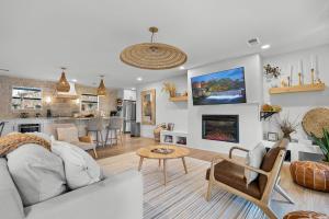 a living room with a couch and a table at Relaxation & Recreation by American Patriot Getaways in Glade