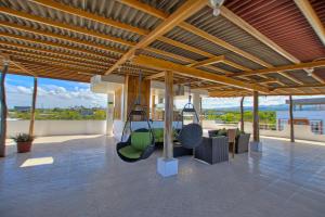 a living room with swings in a house at El Descanso del Guia in Puerto Ayora