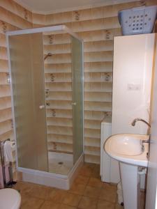 a bathroom with a shower and a sink at Location Laroque Cévennes in Laroque