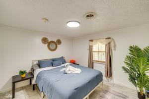 a bedroom with a bed with a stuffed animal on it at Cozy House on Meadowbrook Lake Serene, Scenic! in Stow