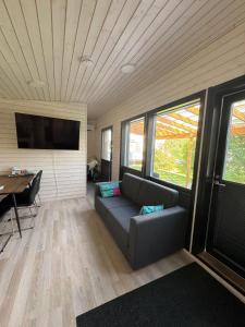 a living room with a couch and a table at Cozy Guesthouse Liminka in Liminka