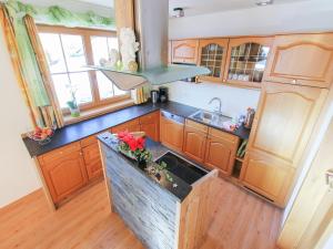 a kitchen with a sink with flowers on it at Holiday home in Taxenbach in Taxenbach