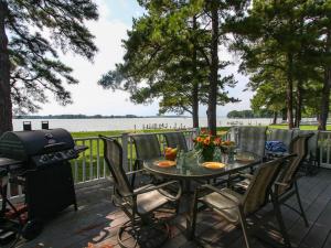a table with chairs and a grill on a patio at Chesapeake Pines in Royal Oak +17 photos
