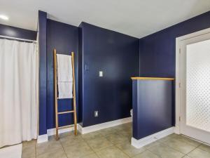 a room with blue walls and a ladder at Eventide of Oxford in Oxford +45 photos