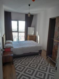 Ένα ή περισσότερα κρεβάτια σε δωμάτιο στο NLogo Prime Residency