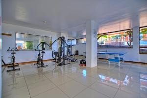 a gym with two tread machines and a table at El Descanso del Guia in Puerto Ayora