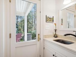 a bathroom with a sink and a window at The Water House in Saint Michaels +76 photos