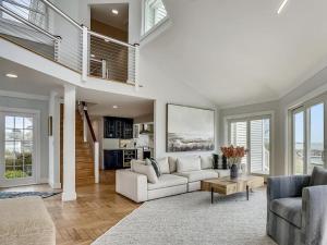 a white living room with a white couch and chairs at Tranquil Waters in Tilghman